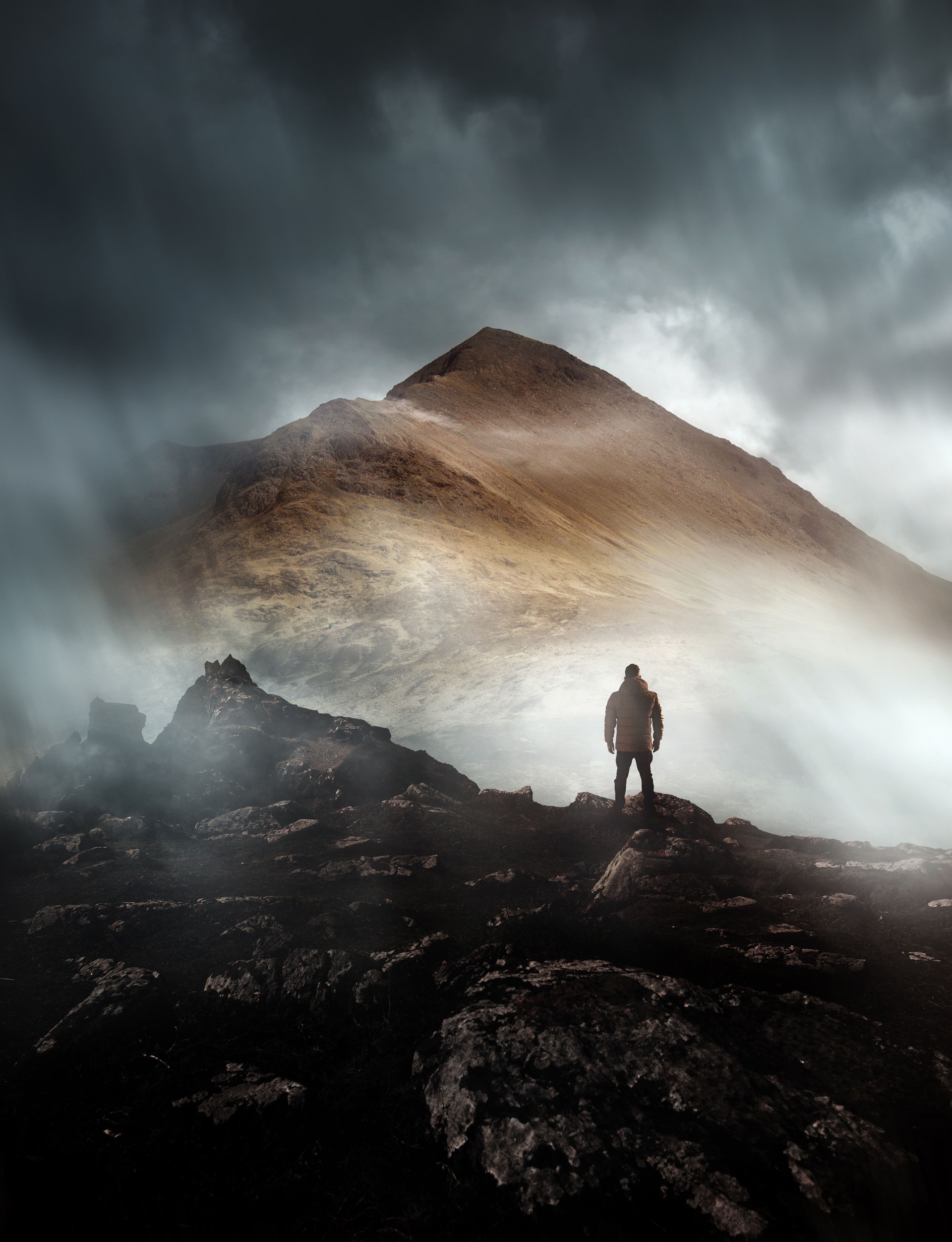 Man Hiking On A Misty Mountain